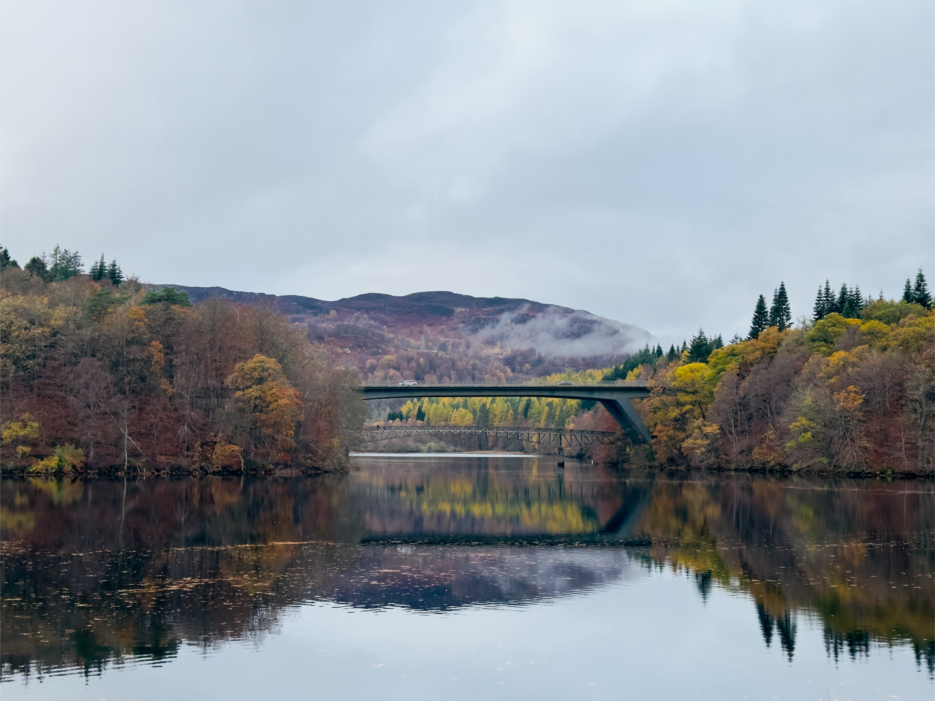 car passed through a bridge in Pitlochry, Scotland in November autumn